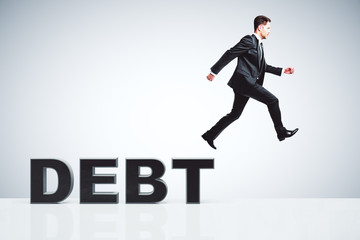 Debt concept with businessman escapes from debts