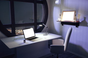 Blank white laptop screen on white table with chair and round wi