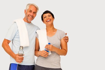 Composite image of portrait of a happy fit couple