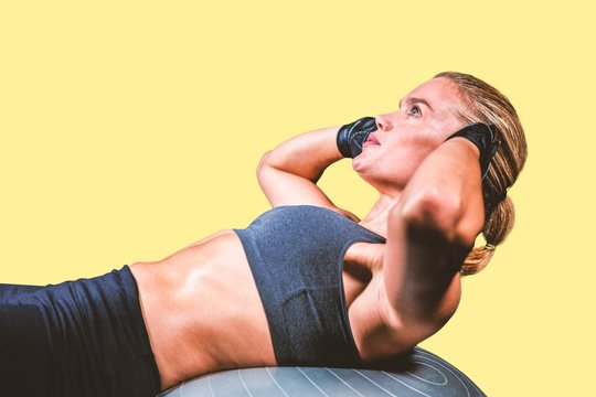 Composite image of muscular woman doing sit ups