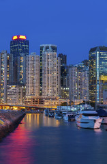 Luxury yacht in port in Hong Kong Harbor at night