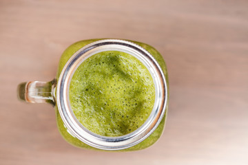 A green smoothie in a mason jar