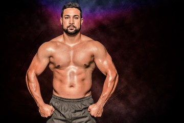 Composite image of portrait of a bodybuilder man flexing muscles