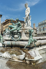Fototapeta na wymiar The famous fountain of Neptune on Piazza della Signoria in Florence, Tuscany, Italy
