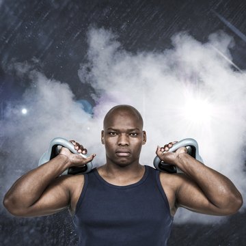 Composite image of muscular man exercising with kettlebell 