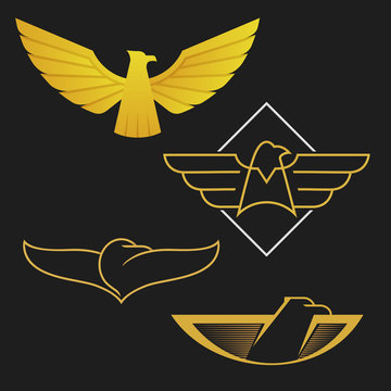 The set of eagles logo icon design. Abstract golden eagles on the dark background.