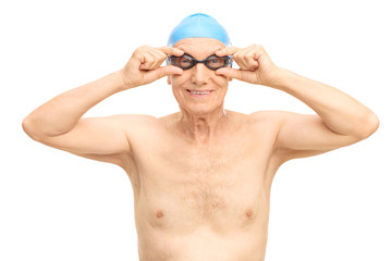 Senior man with black swimming goggles