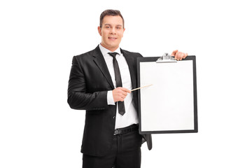 Young businessman pointing on a clipboard