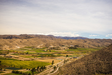 Naklejka premium High altitude Andean landscape with scenic sky
