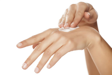 Woman applying hand cream