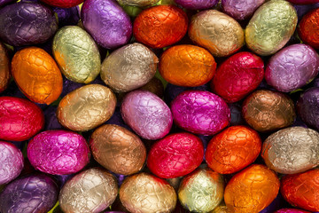 Fototapeta na wymiar Red, yellow and pink chocolate Easter eggs