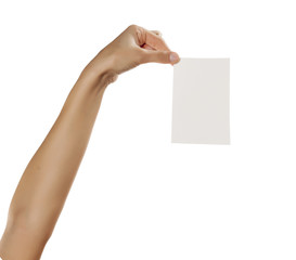 female hand holding a blank sheet of paper