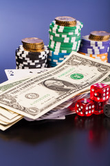 money and set of playing card with dices