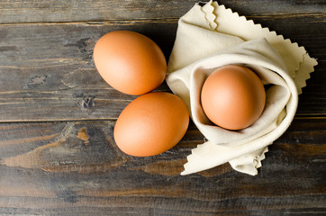 Fresh eggs on wooden background,food ingredient