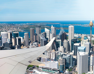 Airplane flying over Sydney. Tourism and holiday concept