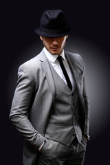 Obraz na płótnie Canvas Portrait of handsome stylish man in elegant suit