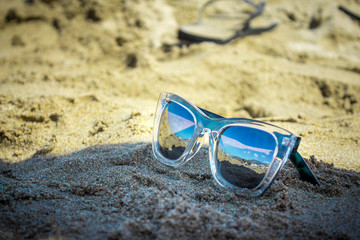 Fototapeta na wymiar Sunglasses on Beach Sand