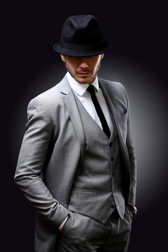 Portrait of handsome stylish man in elegant suit