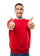 Happy young man with approval gesture