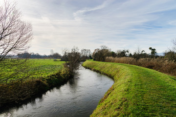 Irrigation canal in winter fields, France