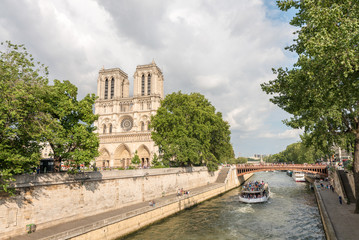 Fototapeta na wymiar Notre Dame along Seine river, Paris