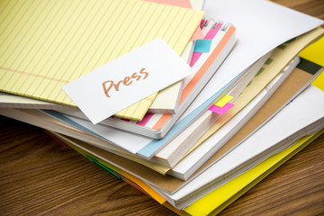 Press; The Pile of Business Documents on the Desk