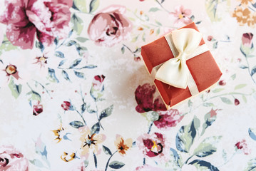 simple surprise little box with bow  on stylish flower paper, ho