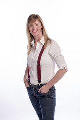 Smiling blond woman wearing braces and blue jeans