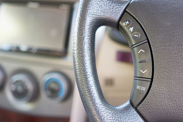 Car steering wheel detail selective focus