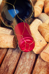 Fototapeta na wymiar red wine bottle and corks