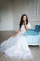 Fototapeta premium Beautiful girl in a gorgeous white dress
