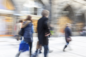 Urban move, people walking in city, motion blur, zoom effect