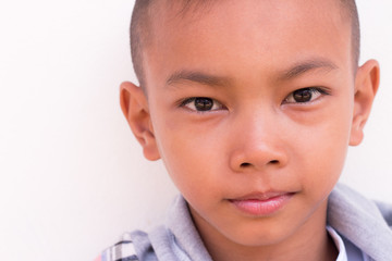 Confident look of the child, close-up of boy. Kid's face with fo
