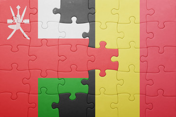 puzzle with the national flag of oman and belgium