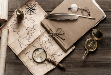 An old brass compass on map background