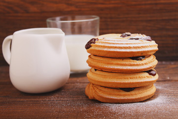 cookies with powdered sugar on a dark background