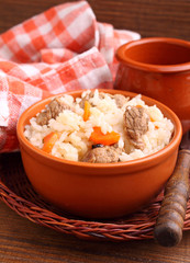 rice with meat and vegetables in pottery