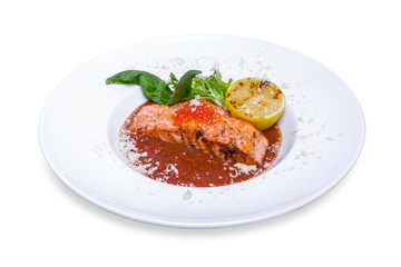 Salmon in red tomato sauce with caviar, isolated with clipping path