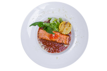 Salmon in red tomato sauce with caviar, isolated with clipping path