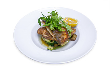 Cooked dorado fish with vegetables, isolated with clipping path