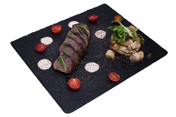 Veal steak with porcini mushrooms, top view