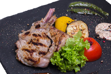 Grilled veal chop on the bone, closeup