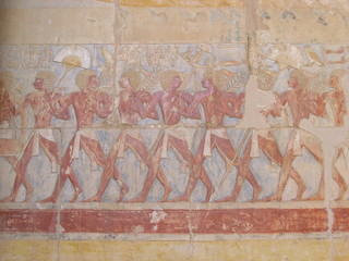 Drawings on the wall of Hatshepsut temple in Luxor region of Egypt
