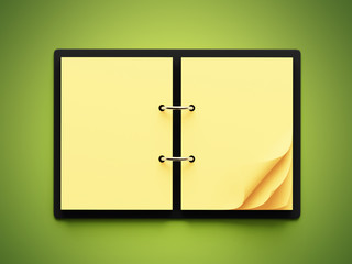 Blank Yellow Paper Notepad isolated on green background