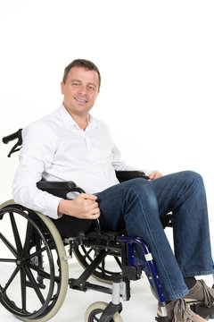 Portrait of charming man in wheelchair. Isolated on white