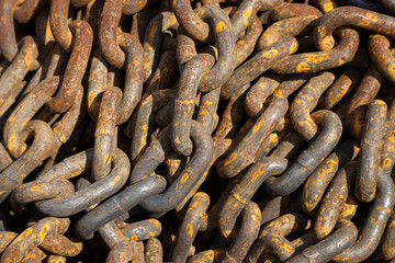 Old rust metal chain heap texture industrial abstract background 