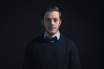 Obraz premium Hipster man wearing dark blue sweater and light blue shirt with