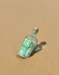 Bottle with money found on the beach, a hundred euros