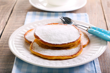 Pancakes with icing sugar topping,