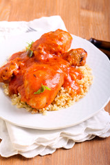 Chicken drumsticks in tomato sauce